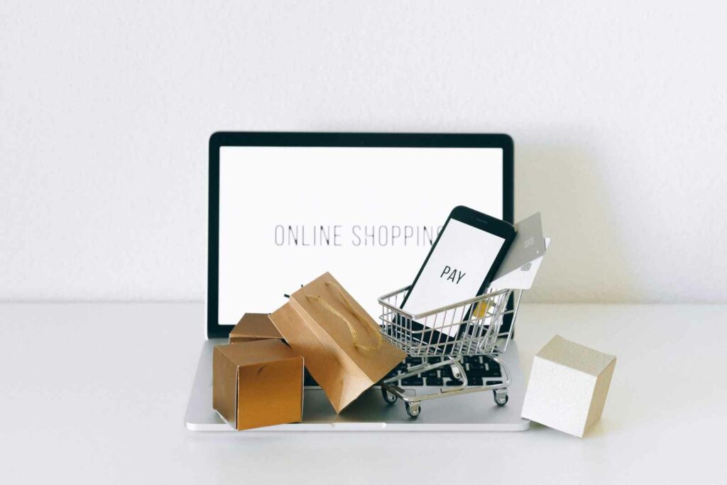 Photo by Nataliya Vaitkevich: https://www.pexels.com/photo/a-miniature-shopping-cart-on-macbook-laptop-6214476/